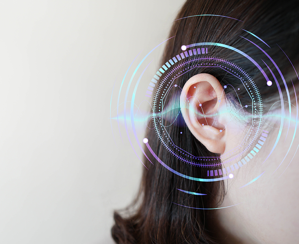 soundwaves on young womans ear dark hair