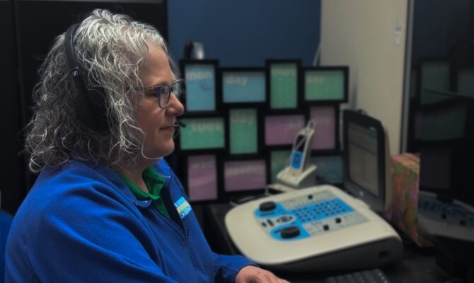 cta stacked theresa performing hearing evaluation in sound booth