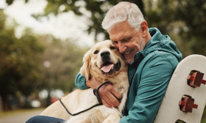 cta stacked senior man hugging dog on park bench