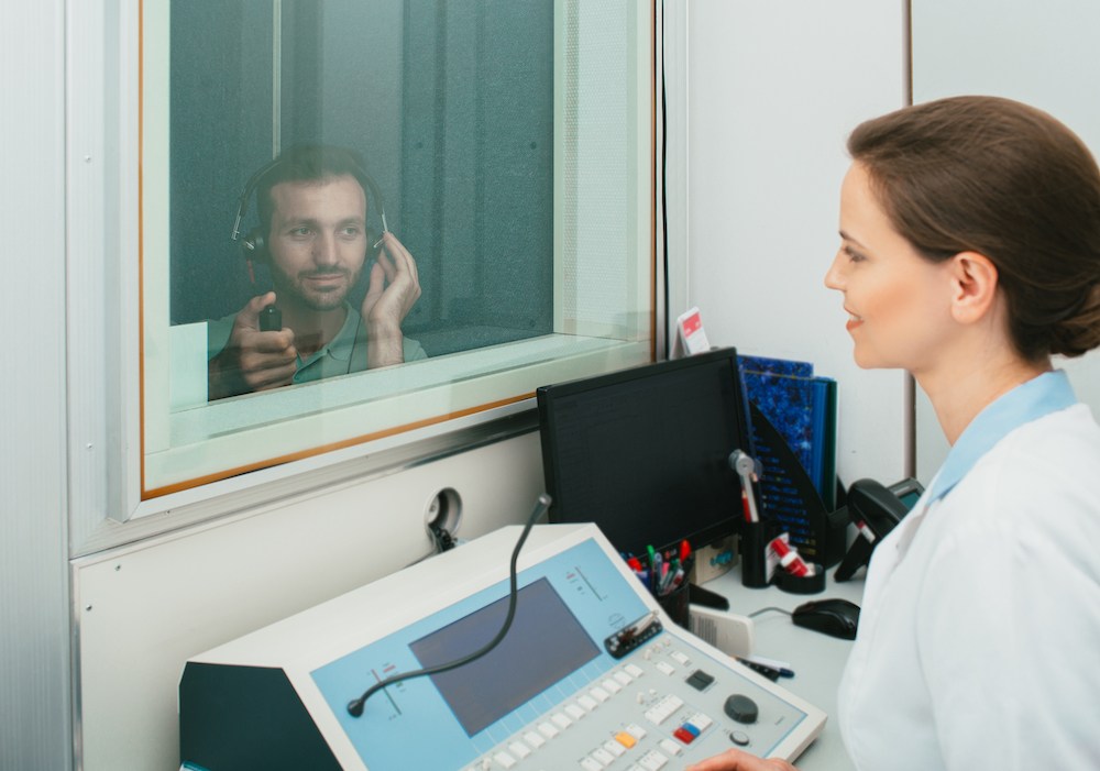 ear doctor in the midst of creating an audiogram for her hearing loss patient