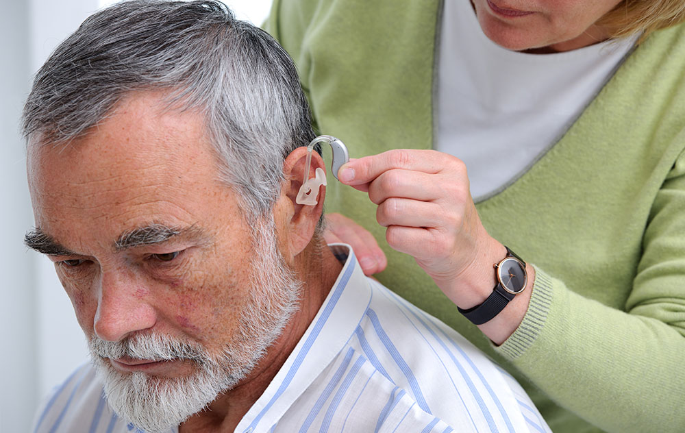 Elderly Man with Hearing Aid