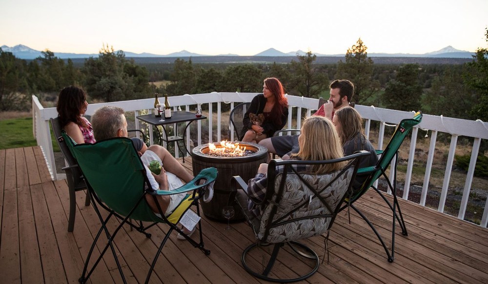 friend group around fire pit