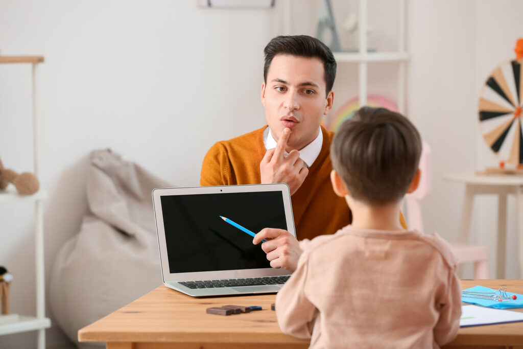speech therapy male provider instructing small child