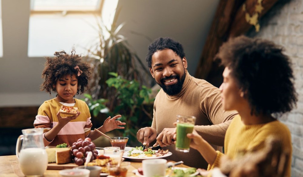 young african american father daughters breakfast