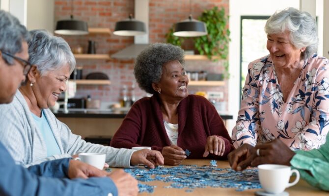 cta stacked senior friends putting a puzzle together