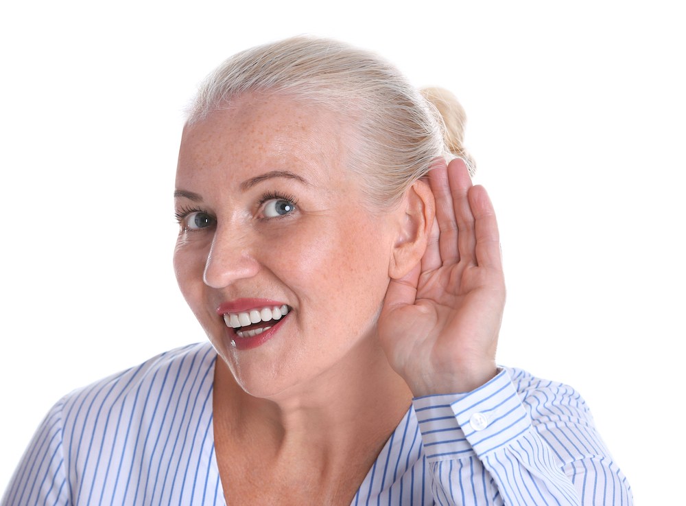 smiling hearing loss patient struggling to hear properly 1