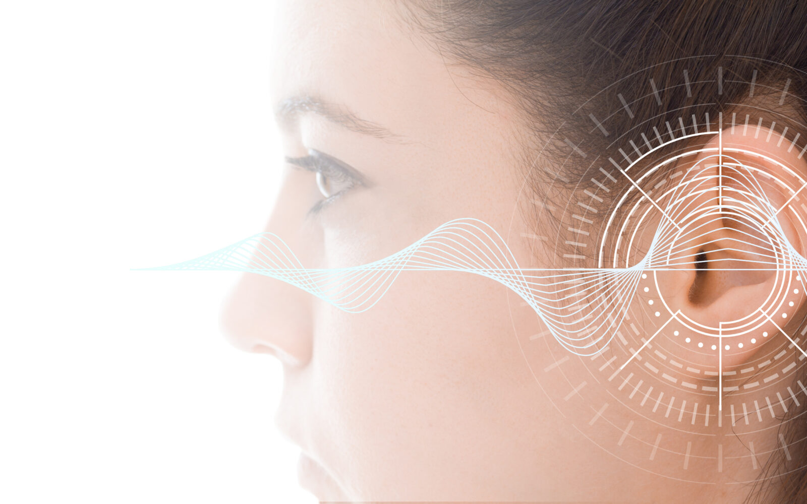 Hearing test showing ear of young woman with sound waves simulation technology