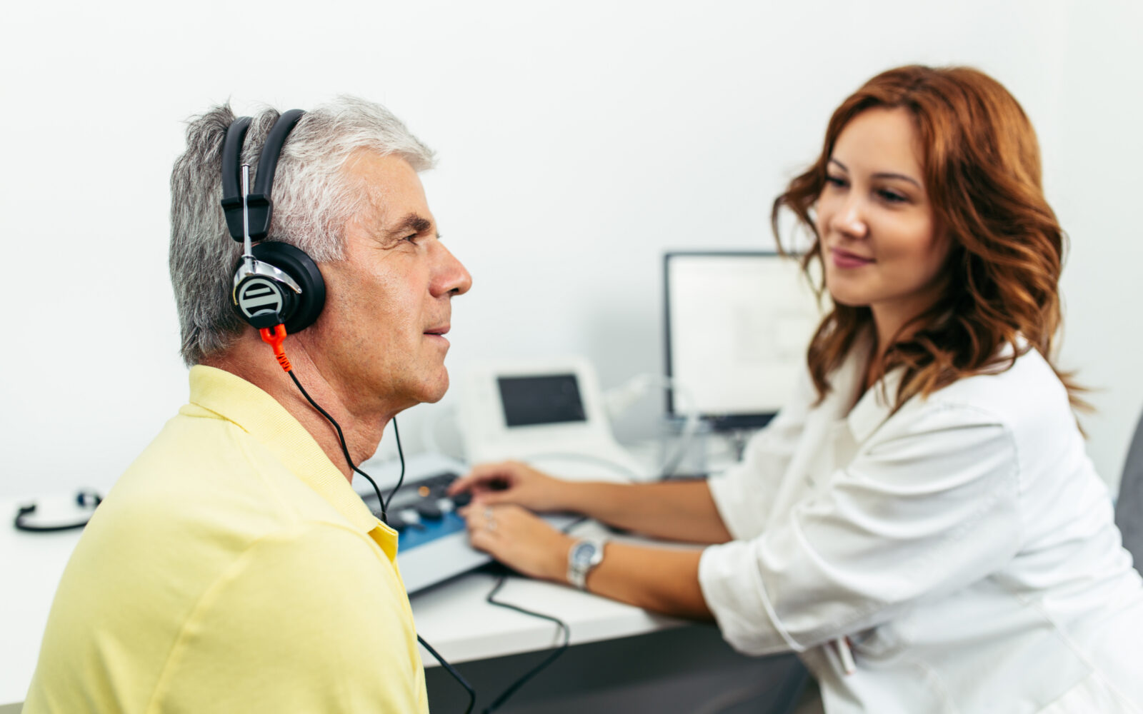 Senior man at medical examination or checkup in otolaryngologist's office