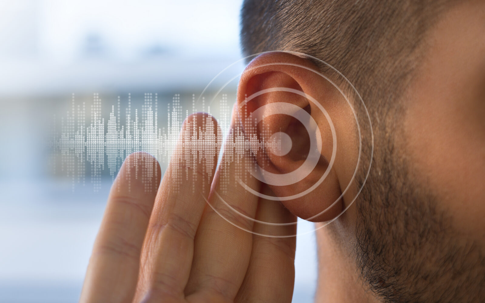 Young man with hearing problems or hearing loss Hearing test concept