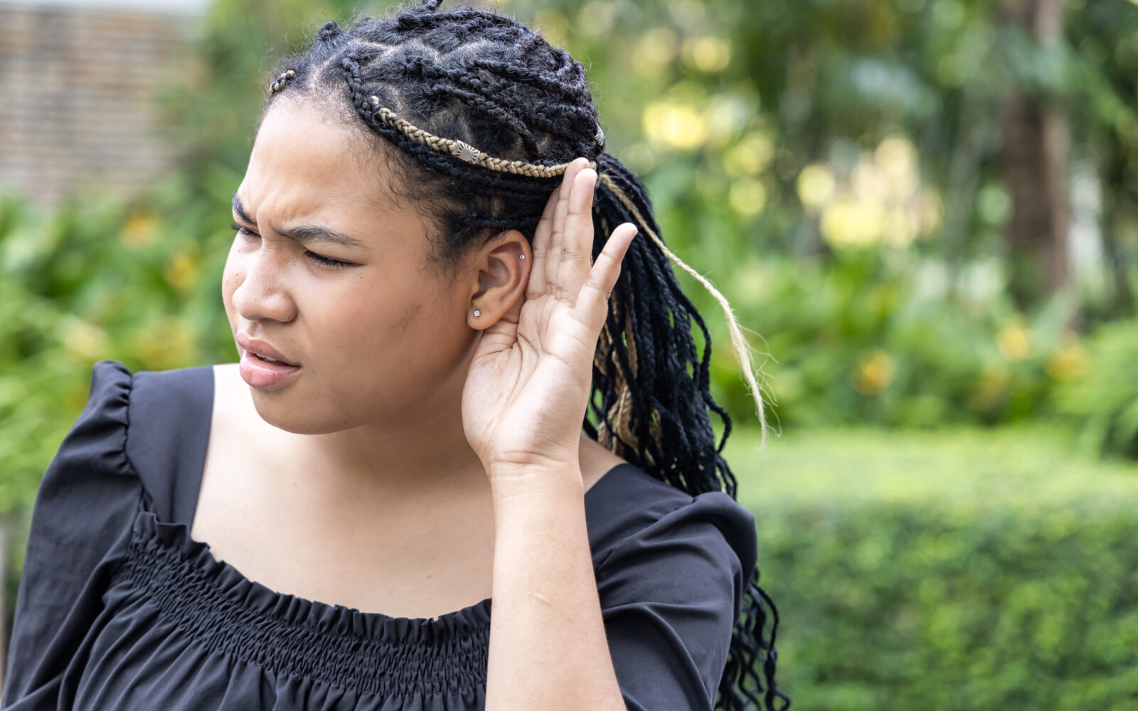 Upset African woman hearing or listening to bad news
