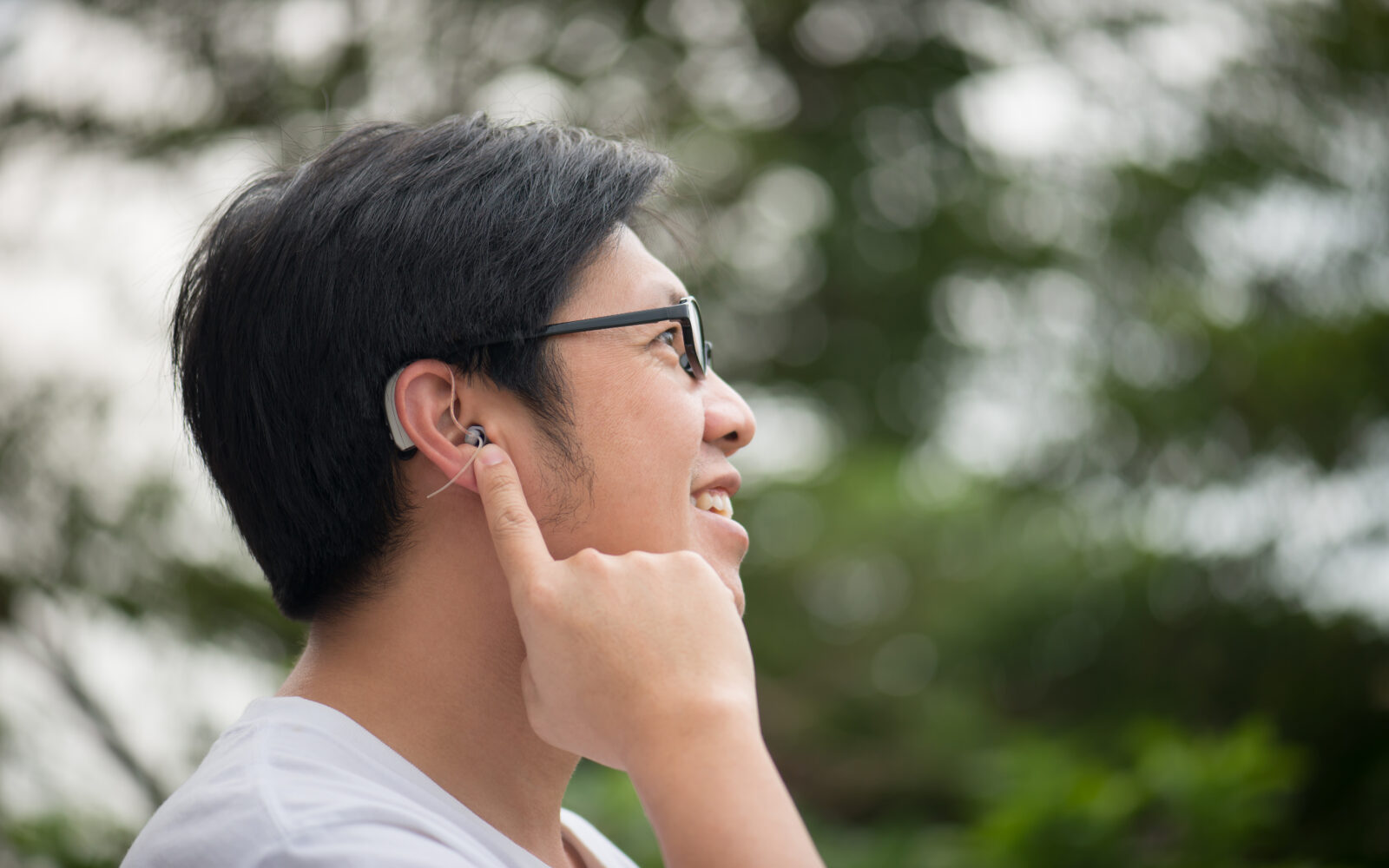 man with hearing aid behind the ear