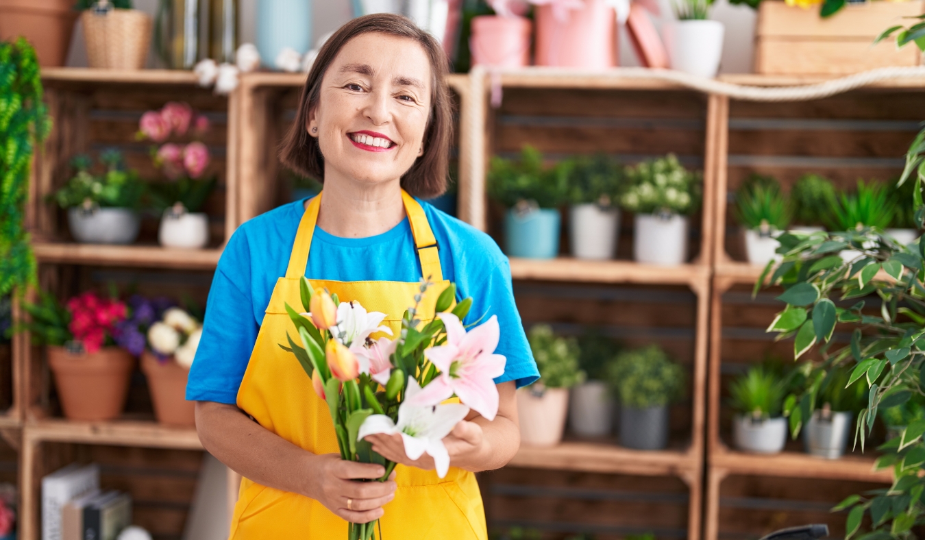 mature woman working in flower shop