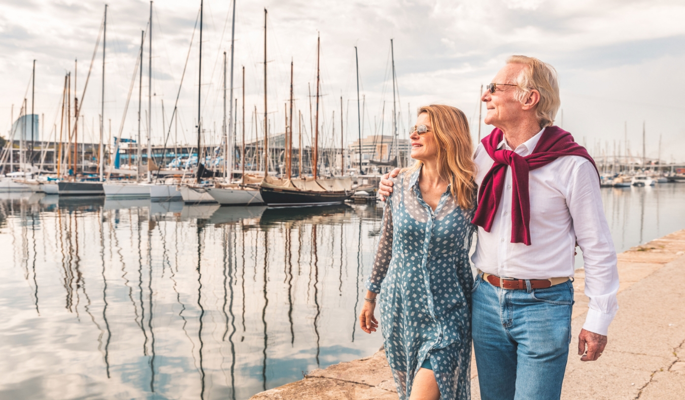 Senior couple walking near the port