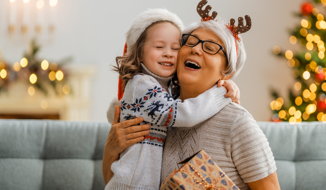 mature couple standing on porch and drinking hot drinks