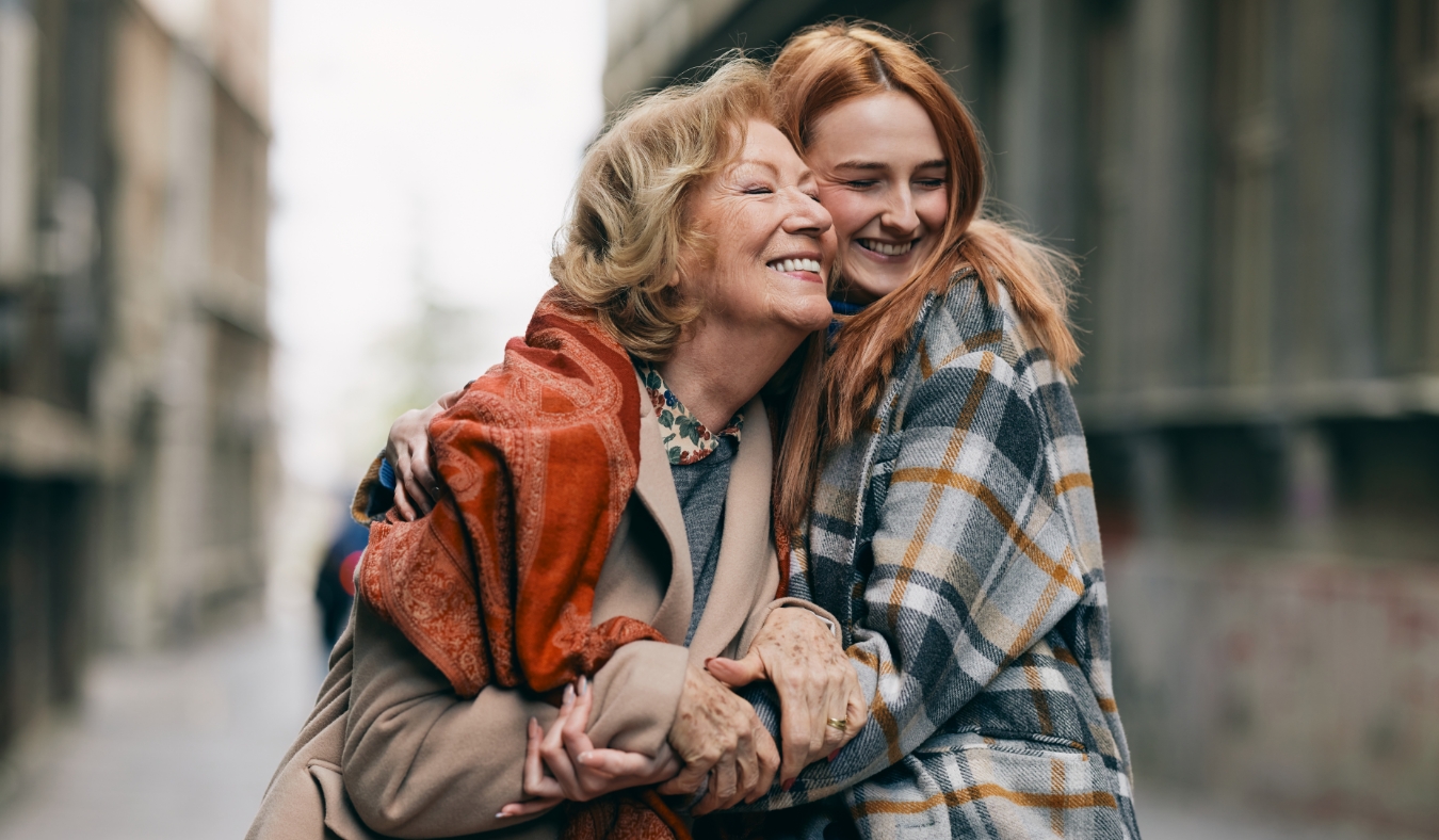 senior couple walking in tropical city during autumn