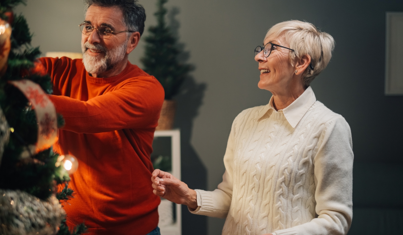 couple decorating christmas tree