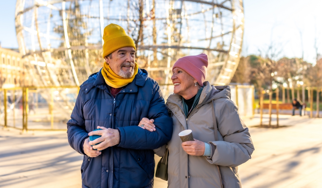 couple drinking coffee on a chilly morning walk