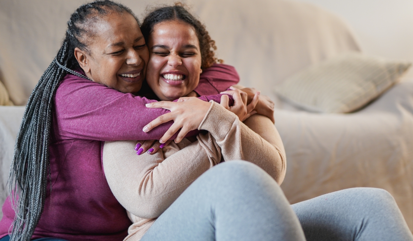 mother hugging adult daughter