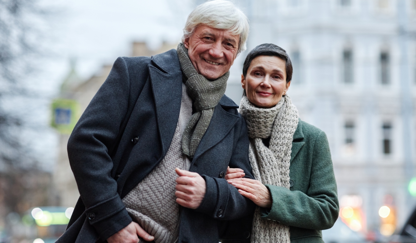 senior couple enjoying chilly weather smiling