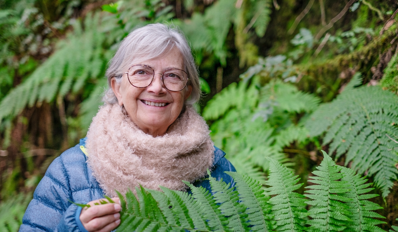 senior woman smiling outside on winter day