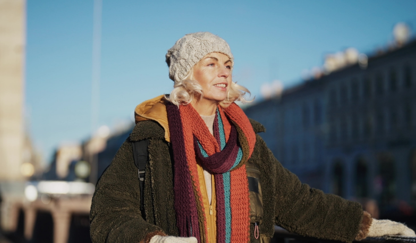 woman dressed for cold weather walking through city
