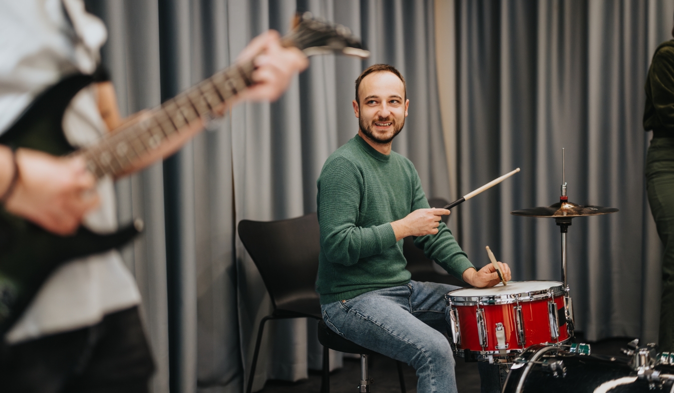 band rehearsing music together in a studio