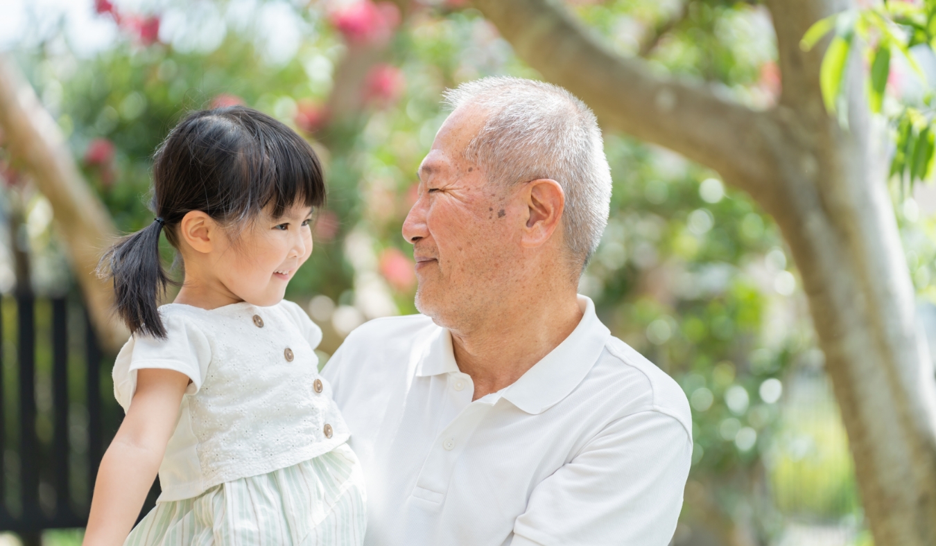 senior asian couple enjoying morning yoga outside
