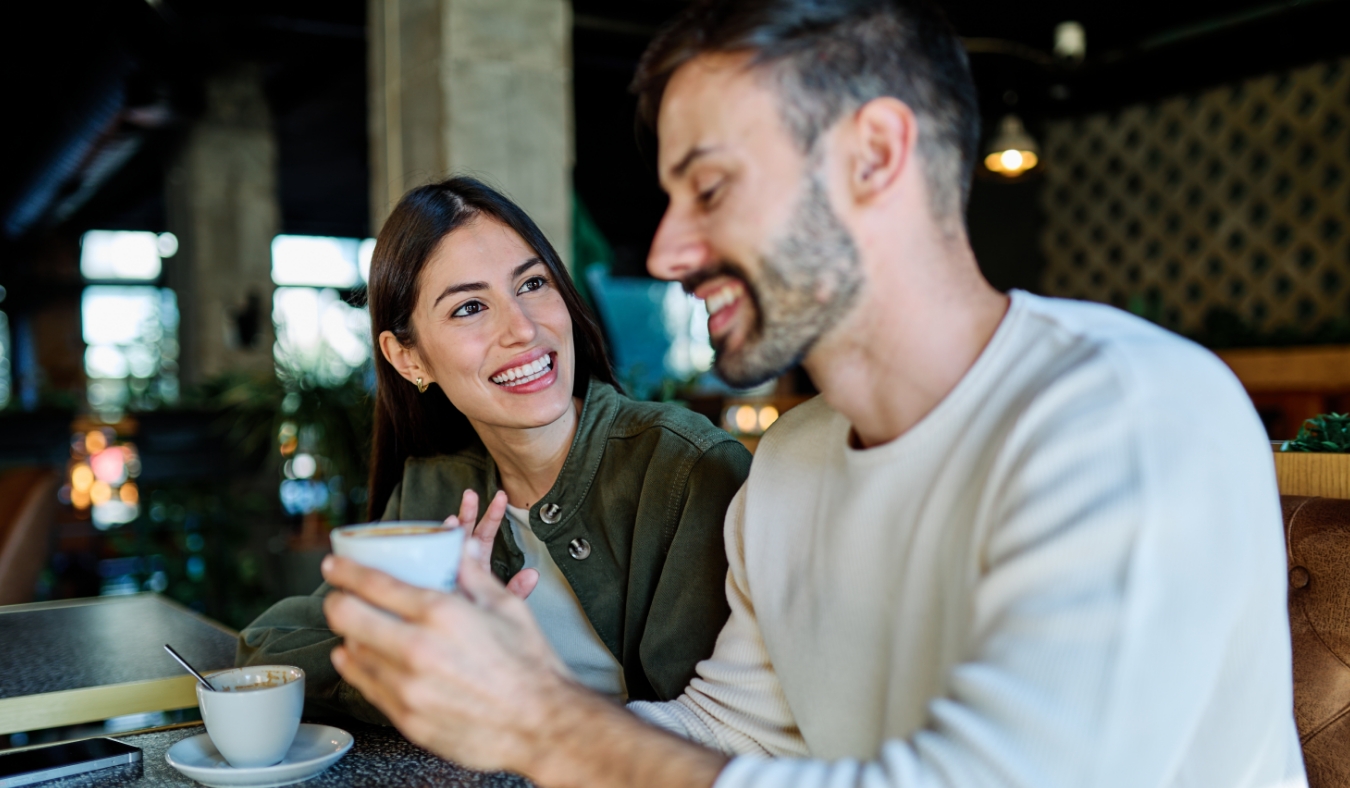 couple enjoying enjoying coffee at cafe