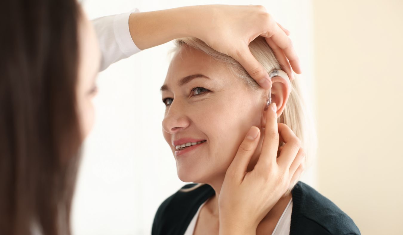 women trying hearing aid