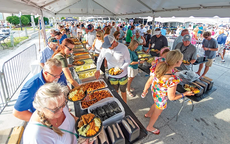 Exterior of Safe Harbor Old Port Cove marina building with yachts docked