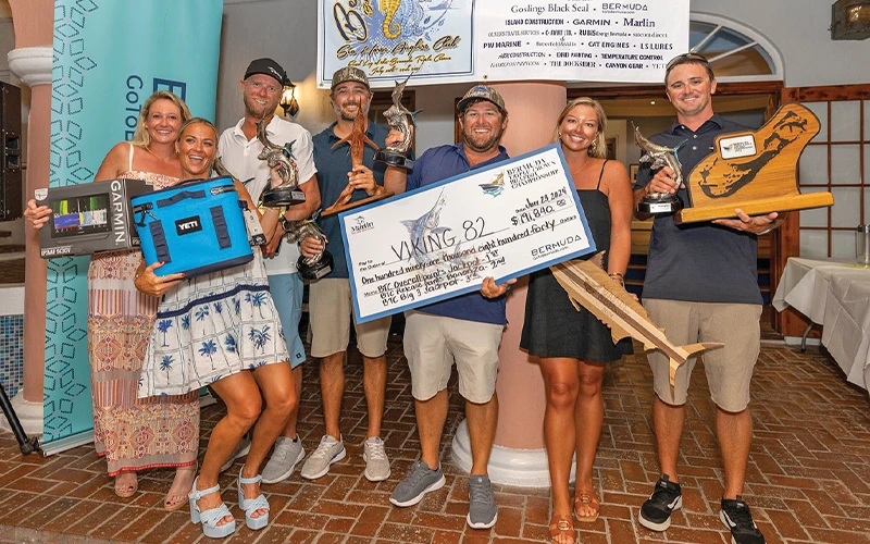 Team Viking 82 holds trophies and a giant check after placing in the Bermuda Triple Crown