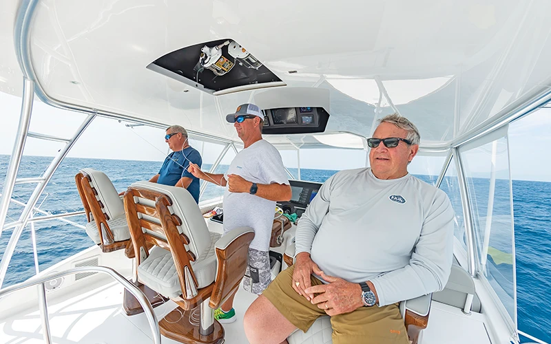 3 Crew members in the bridge of the Viking 64C