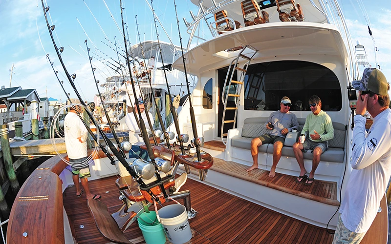 Viking 64 team prepares for a tournament day dockside with rods rigged and cockpit ready