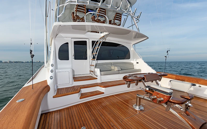 The teak cockpit and mezzanine seating of the Viking 64 showcase luxurious tournament-ready design