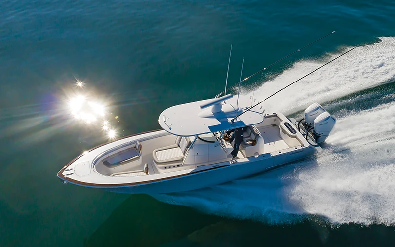 Aerial view of the Valhalla V-33 cruising at speed with twin Mercury engines and fishing rods on open water