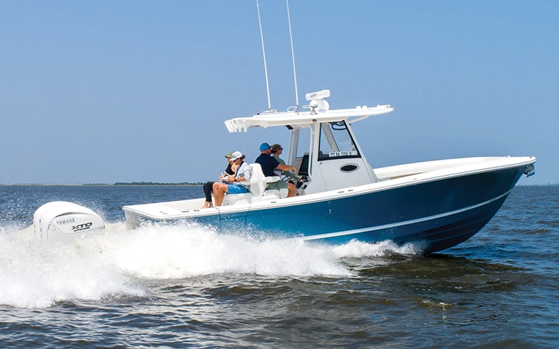 Regulator center console boat cruising offshore with passengers aboard during a demo ride