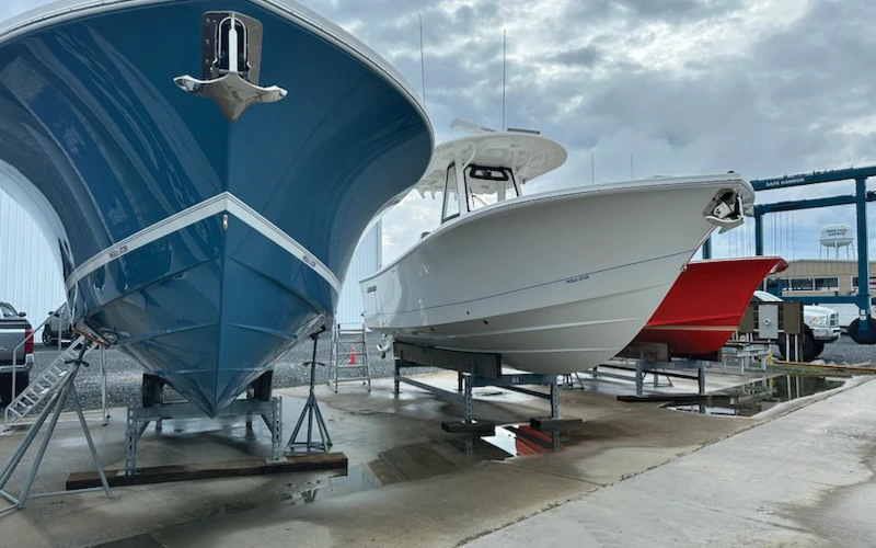 Regulator boats on stands at a service yard, showcasing hull colors and offshore-ready construction
