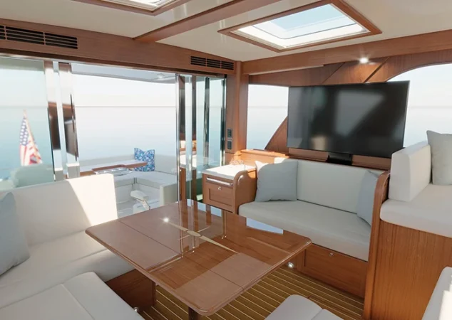 Main salon and entertainment area of the Sabre 51, with large windows, flat-screen TV, and multiple seating zones