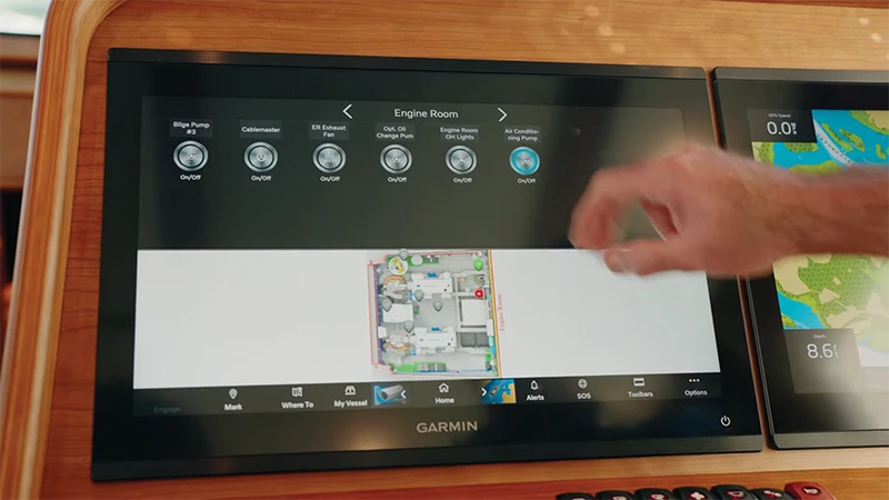 Close-up of a digital monitoring screen on a Sabre 45, displaying system status including gauges, video feed, and control options