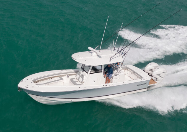 Regulator 31 fishing boat cruising clear blue water