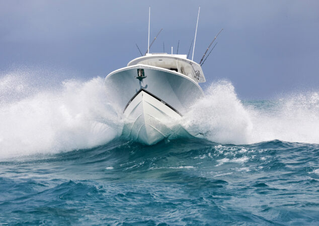 Regulator 31 powering through ocean waves bow up