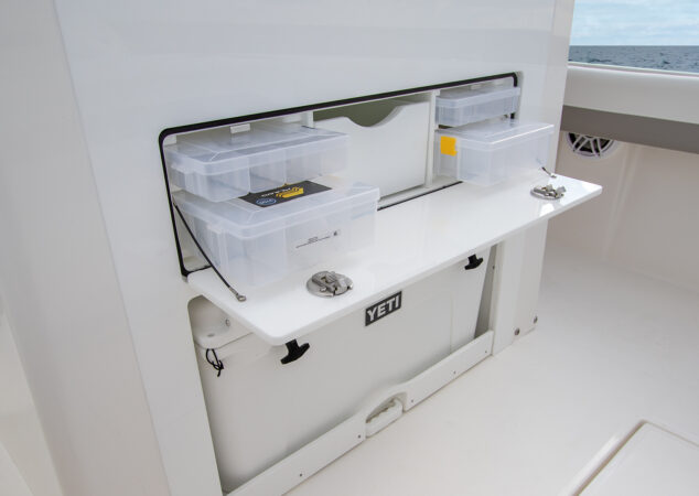 Pull-out tackle storage drawer with multiple plastic tackle trays
