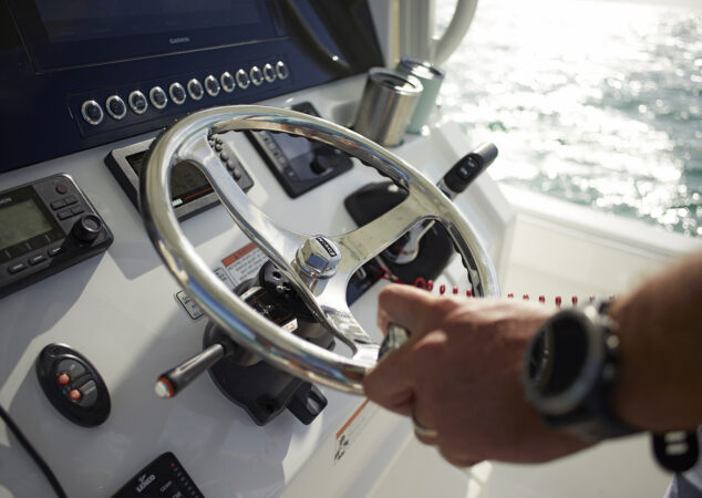 Captain at helm station of the Regulator 26XO