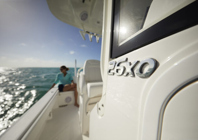 Model looking down the gunwale on Regulator 26XO