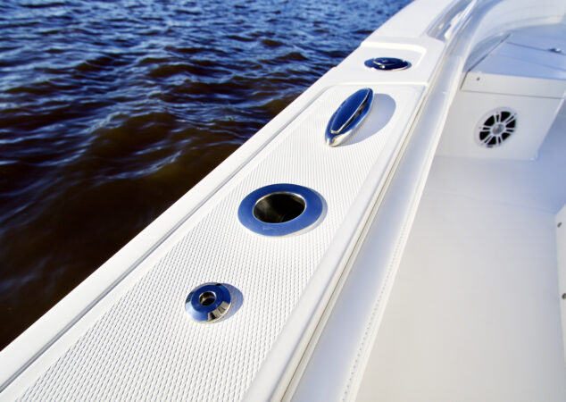 Flush-mounted rod holder and cleat on Regulator 26XO gunwale