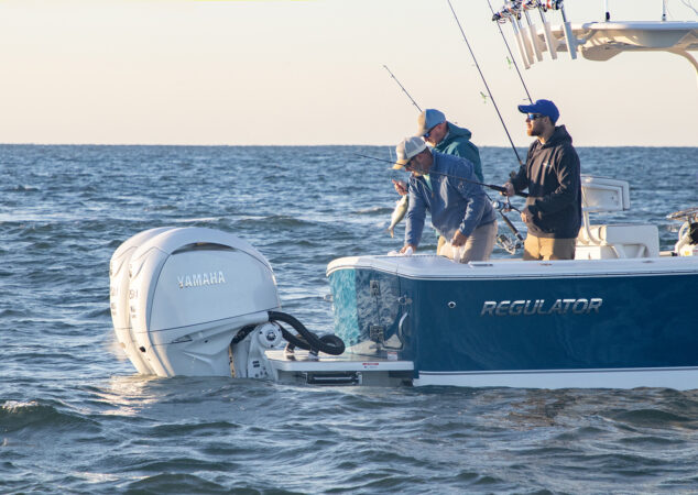 Stern view of anglers fishing off Regulator 25 with Yamaha outboards