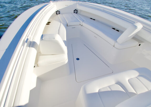 Angled view of cushioned bow seating with backrests on the Regulator 25