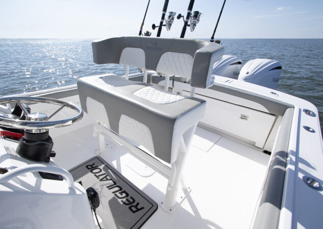 Leaning post seating with diamond-stitched cushions and rod holders on a Regulator 25