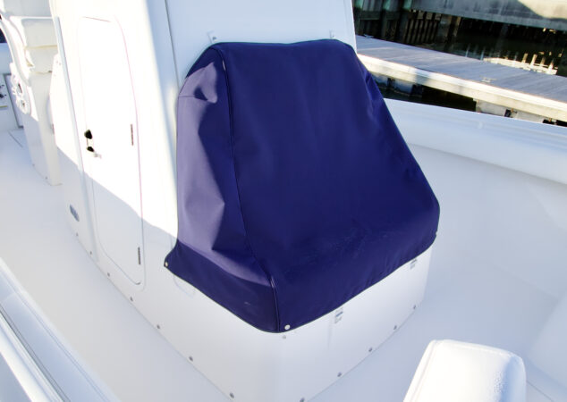Dark blue canvas cover protecting the forward seating on a Regulator 25