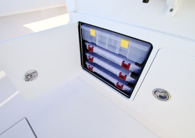 Tackle storage drawers with organized plastic boxes inside a side compartment